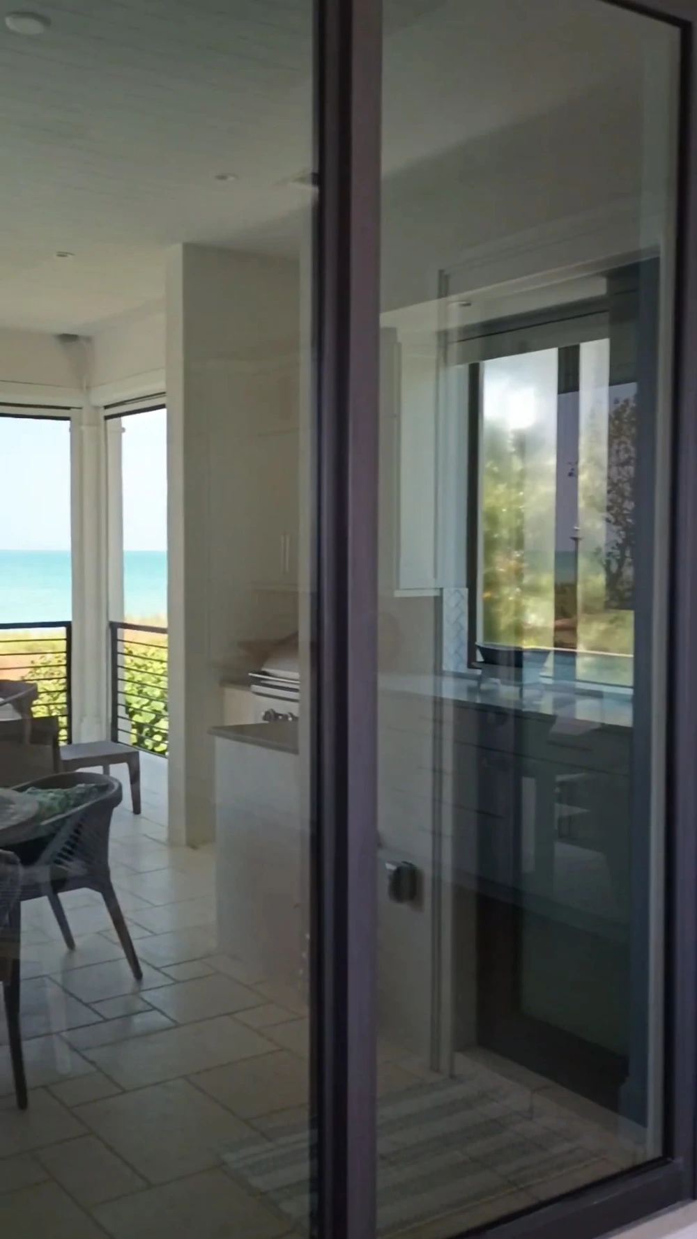 Ocean-facing sliding door with a clear, unobstructed ocean view after professional cleaning, San Clemente, CA